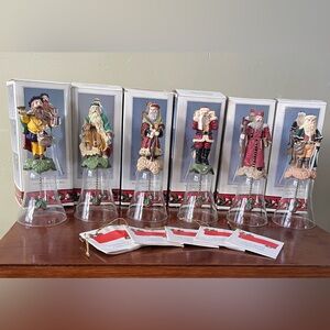 Novelino ChristmasThrough the Ages Santa Bell Set